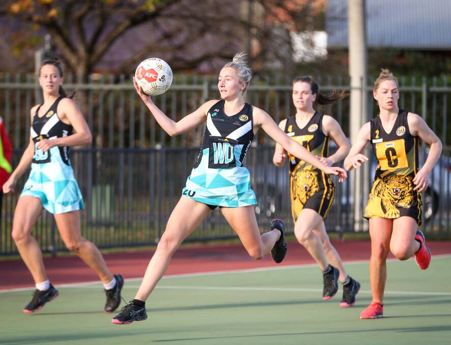 FLYING DOWN COURT: Lavington's wing defence Laura Hueske in full flight during the Panthers win against the Tigers on Saturday. Picture: JAMES WILTSHIRE