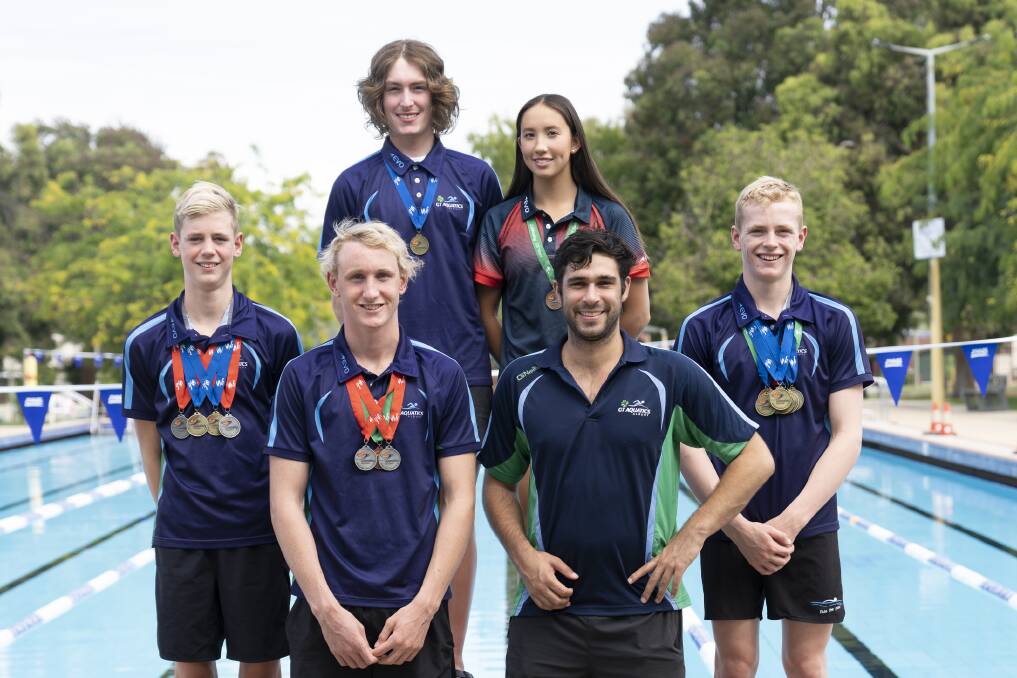 SMILE: Nicholas Evans, Alicia Spiers, Archie Kreutzberger, Lachie Elgin, coach Mitchell Brown and Oscar Kreutzberger of SwimTech Albury with their medals. Picture: suppiled