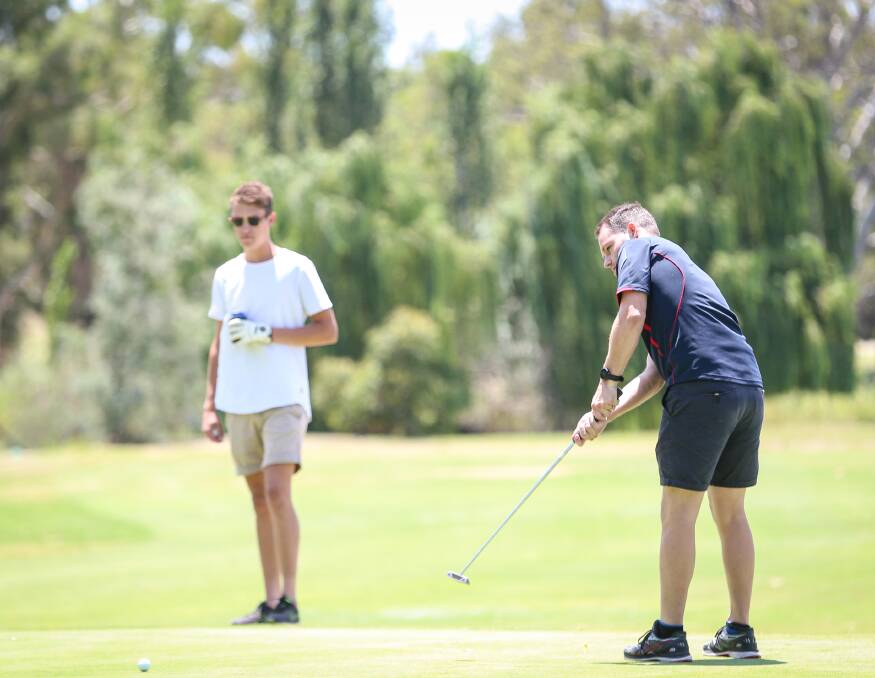 PERFECT CONDITIONS: Wodonga Raiders coach Jarrod Hodgkin makes his way onto the green during the charity golf day held at the Wodonga Golf Club.