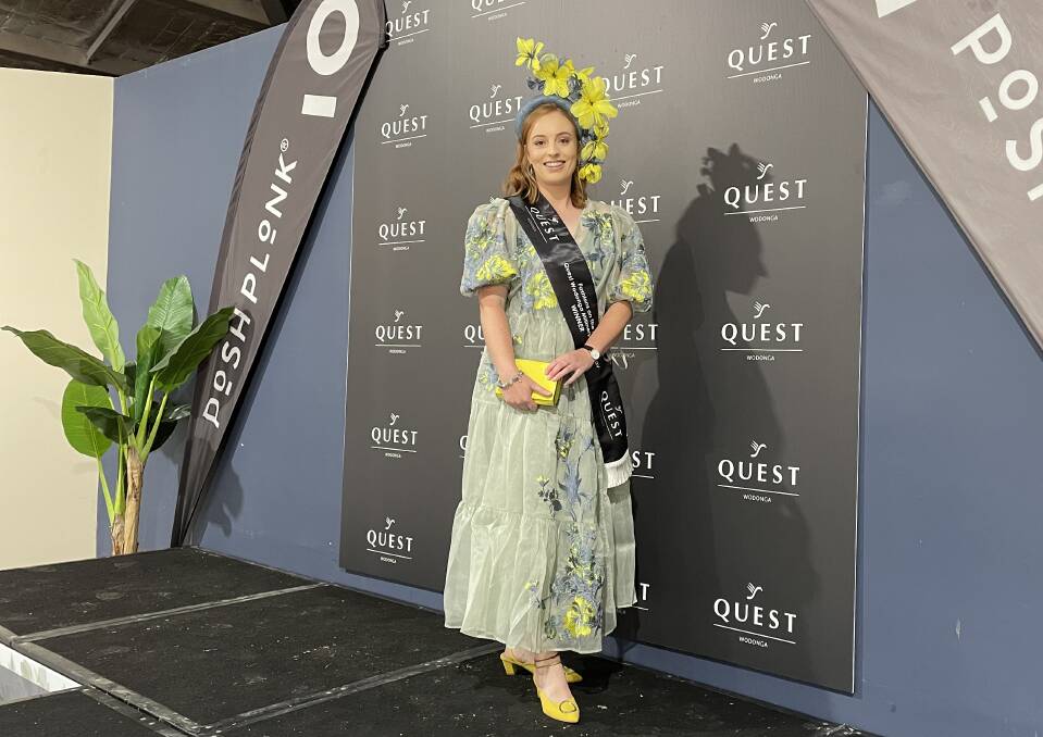 FOR YOU, MUM: Sarah Cox of Wodonga claimed the Millinery Award for her yellow headpiece during the Fashions on the Field yesterday.
