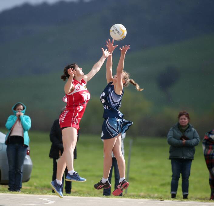 Federal's Amy Paton and Cudgewa's Joanne Beirs go up for the ball in the Upper Murray league grand final on Saturday. Picture: TARA TREWHELLA.