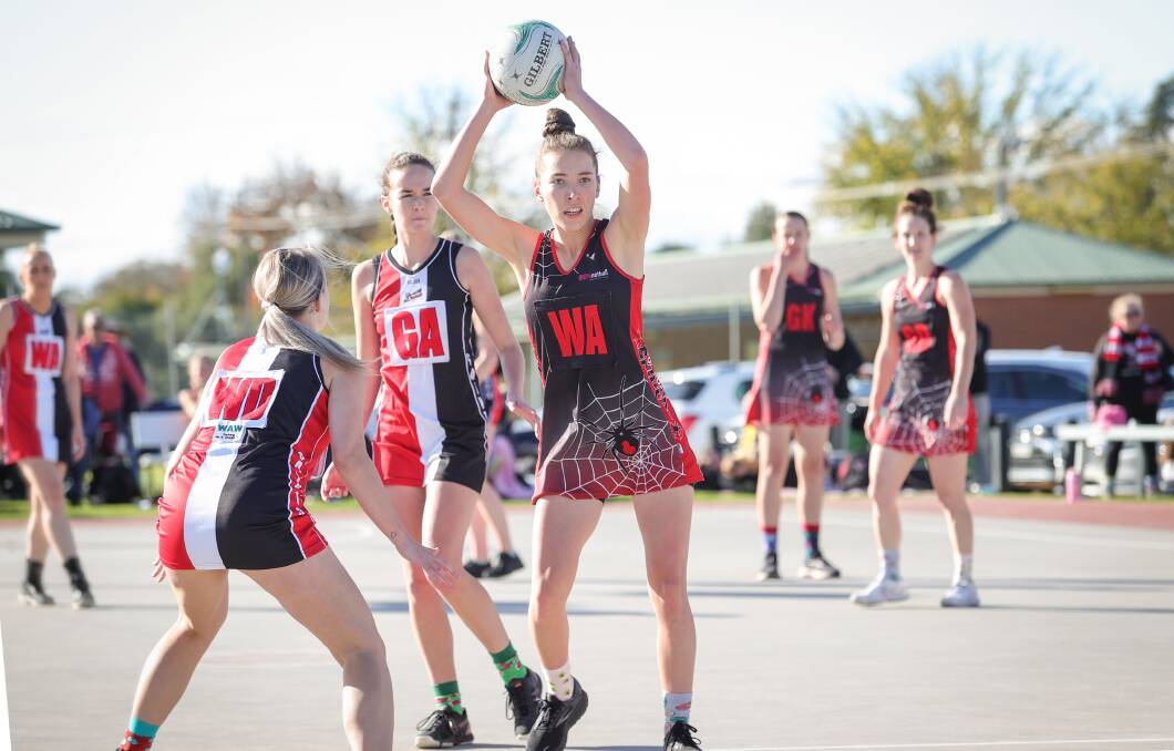 TRIBUTE: Howlong's Marney Gorman in action against Brock-Burrum on Saturday for Odd Socks Day in memory of late netballer Aimee Koehler. Picture: JAMES WILTSHIRE