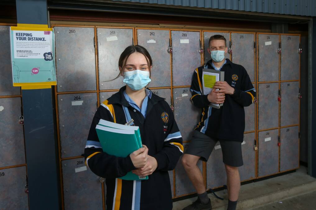 RESILIENT: Catholic College Wodonga's school captains Nichola Barrett and James McKenzie-McHarg make the most of being at school before Victorian cohorts return to remote learning. Picture: TARA TREWHELLA