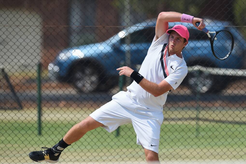 HARD FOUGHT: Margaret Court Cup winner David Poole of Shepparton keeps his balance during the Victorian Junior Grass Court Championship finals.