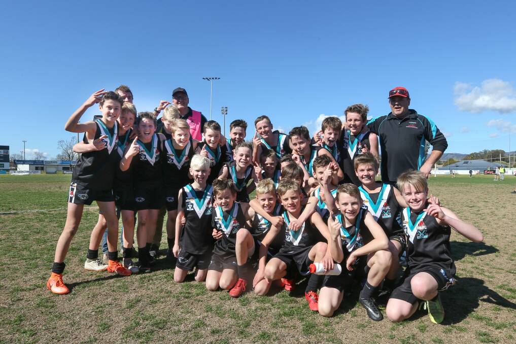 WINNING FEELING: Lavington celebrates taking out the under-12's flag against Corowa-Rutherglen by a convincing margin.