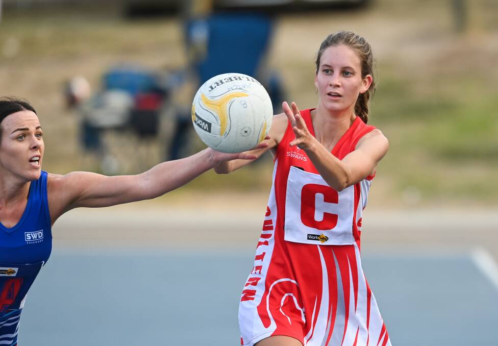 DEFENSIVE PRESSURE: Mardi Nicholson gets her hand to the ball against Chiltern's Ella Eagle during the Swans' win at Thurgoona on Saturday. Picture: MARK JESSER