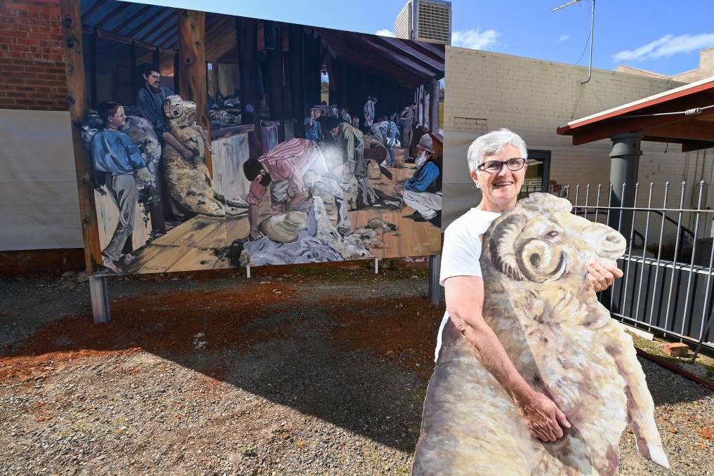 Woolly ideas: Lesley New with a sheep cutout and Tracy Hancock's version of Shearing the Rams to be unveiled on Saturday. Picture: MARK JESSER