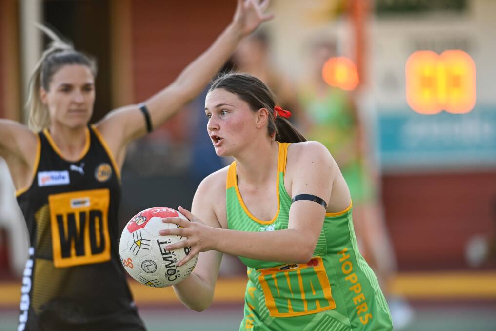 RIVALS: North Albury's Niamh Boyer looks for passing options under the defensive pressure of Tigers' Sarah Jones. Picture: MARK JESSER