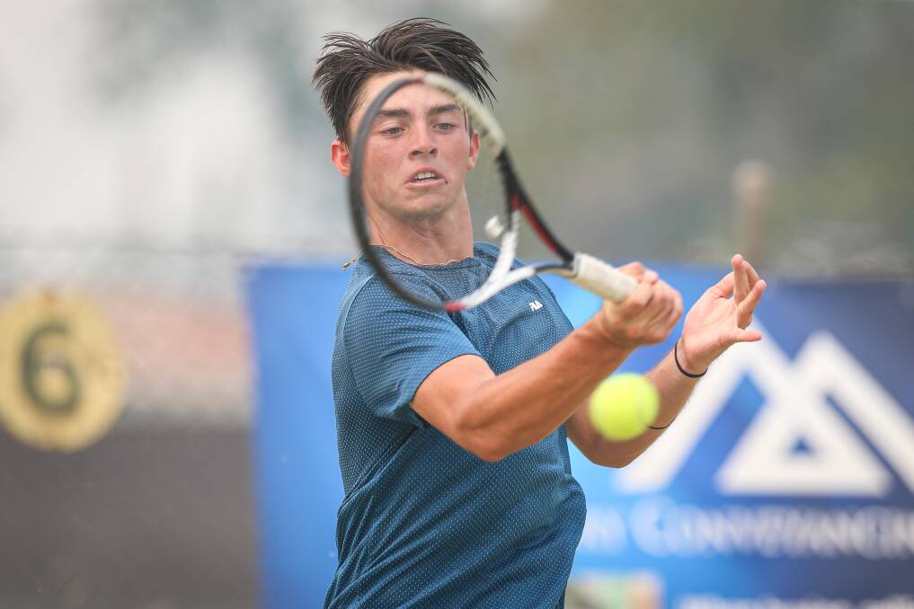 FOCUSED: Men's AMT singles runner-up Matthew James Scheers smashes a forehand during the men's final in Albury.