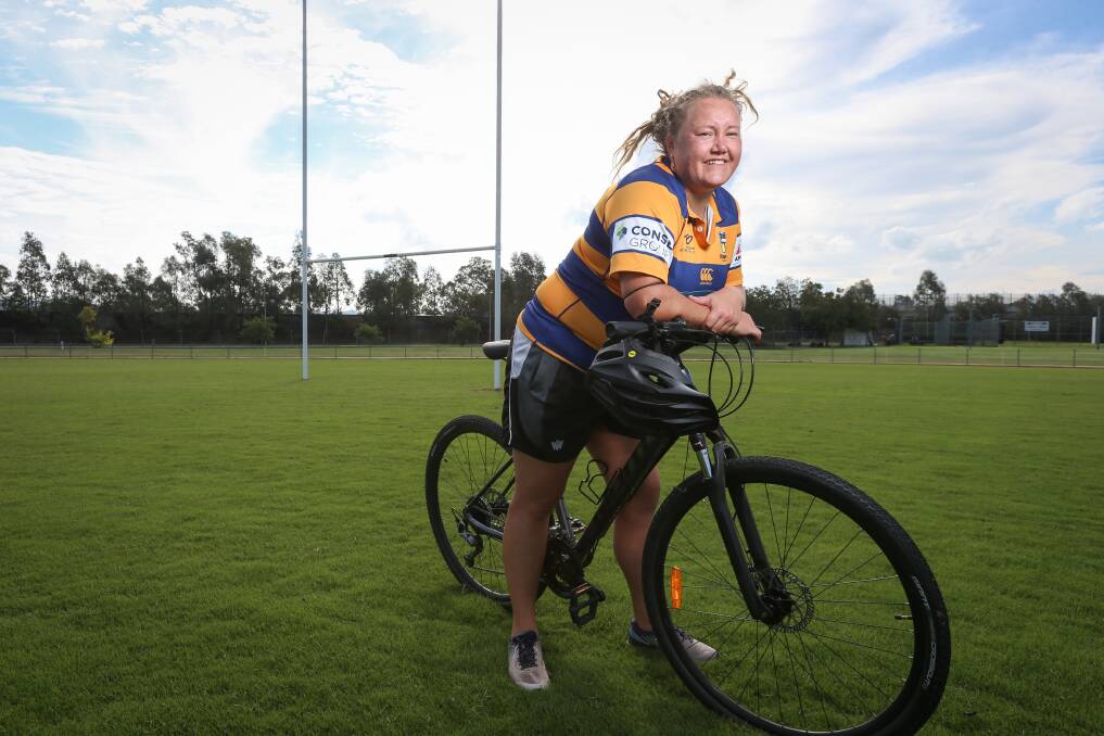 LONG JOURNEY: Steamers womens team manager Elyse Burns has swapped the rugby ball for a bike to help her team rack up kilometres in their quest to race to Spain as part of a fitness challenge. Picture: JAMES WILTSHIRE