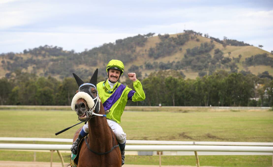WINNERS ARE GRINNERS: Jockey Jason Benbow celebrates after Peter Moody trained Akecheta claimed the Wodonga Gold Cup yesterday.