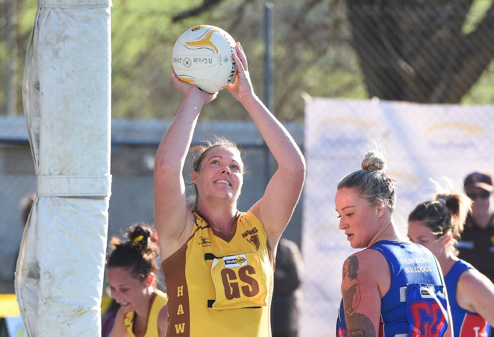 Kiewa-Sandy Creek goal shooter Haylee Penny is hoping to claim her second premiership with the Hawks, after also reaching 100 games with them this season.