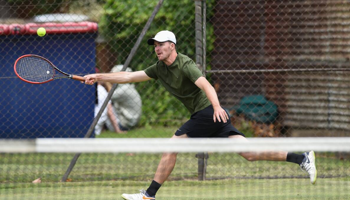 FOCUSED: Border tennis player Lewis Ahern reaches for a forehand during section one men's pennant in Albury on Saturday. Picture: MARK JESSER.
