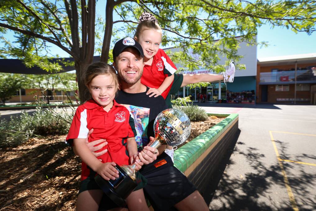 BUST A MOVE: Dancing with the Stars' 2020 winner Jarryd Byrne with his daughters Isobel, 5, and Indi, 7, at Lavington's Holy Spirit School. Picture: JAMES WILTSHIRE