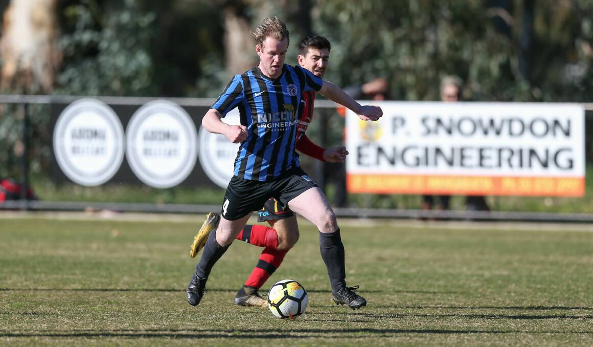 FOCUS: Myrtleford's Jake Miles and Wangaratta's Thomas Romero go head-to-head during the Red Devils one goal win on Sunday. Picture: TARA TREWHELLA.