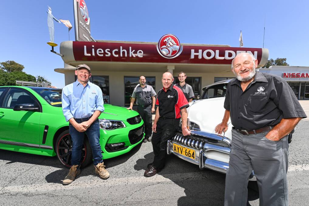 FAMILY TIES: Kim, Anthony, David, Luke and Cecil Lieschke out the front of their fourth generation Holden dealership in Walla. Pictures: MARK JESSER.
