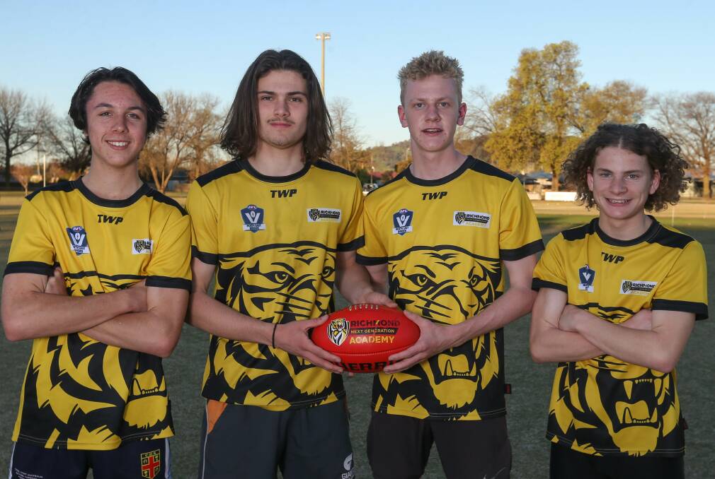 GIVING THEIR ALL: AFL North East Border V-Line Cup squad's Oliver Hollands (left) was dubbed best on ground in the division one side's first game on Wednesday.