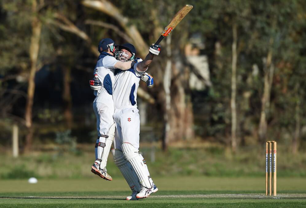 REJOICE: Bartel brothers Jason and Josh celebrate Kiewa's CAW District grand final win against Yackandandah after finishing off the batting together. Pictures: MARK JESSER