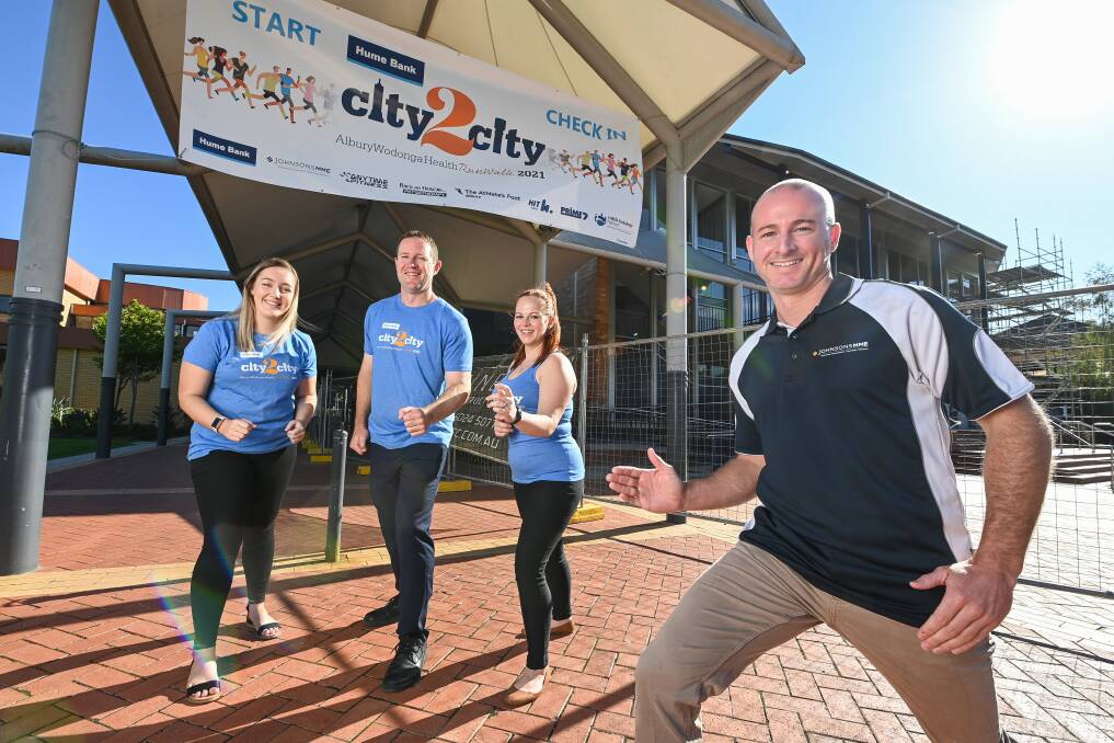 ON YOUR MARKS, GET SET, GO: Albury's Johnsons MME staff Aidan Jenkin (front), Annie Tonta, Paul Goonan and Adele Sakkas are ready to take on this month's City2City. Picture: MARK JESSER