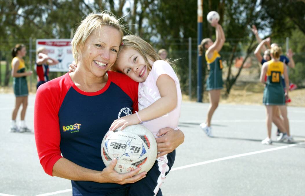 BLAST FROM THE PAST: Ovens and Murray Hall of Famer Lindy Burgess-Singleton with her youngest daughter Tori while coaching Wodonga Raiders during the 2004 season.
