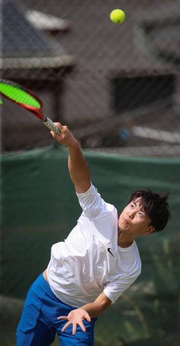 ACE: Daisuke Kobayashi of Japan in action during day one of the Border's annual Margaret Court Cup tennis tournament. Pictures: JAMES WILTSHIRE.
