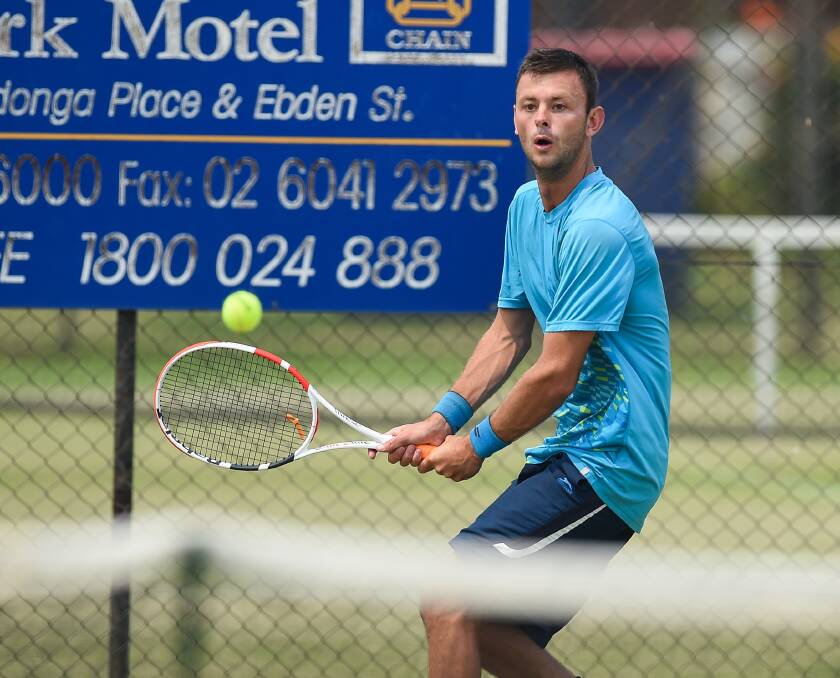 IN THE ZONE: Bradley Petrak from Seafood keeps a close eye on the ball during a singles match at the Albury grasscourts.