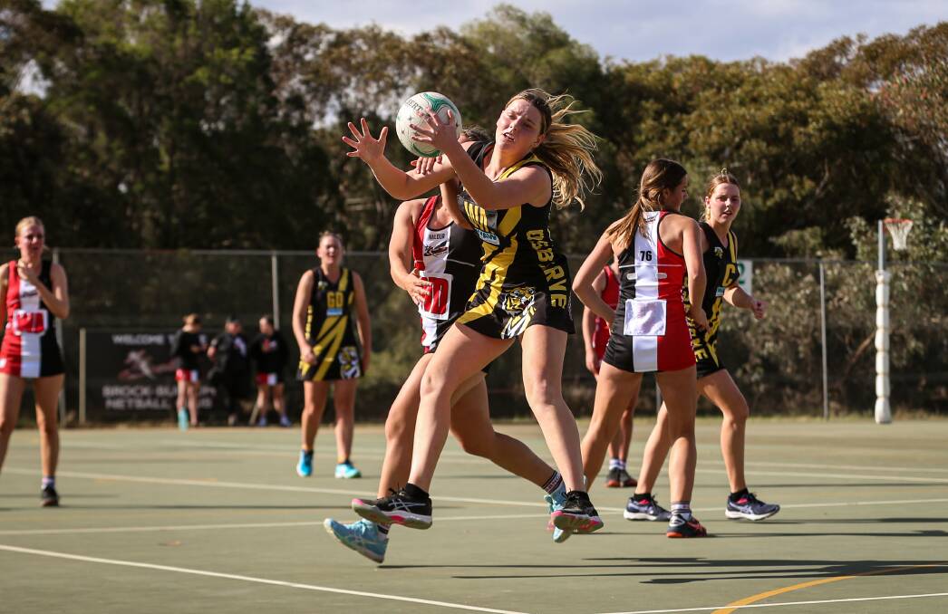 TIGERS ROAR: Osborne's Abbey O'Connell keeps Brock-Burrum's Lucy Ennis at bay during the Tigers win against the Saints on Saturday. Picture: JAMES WILTSHIRE