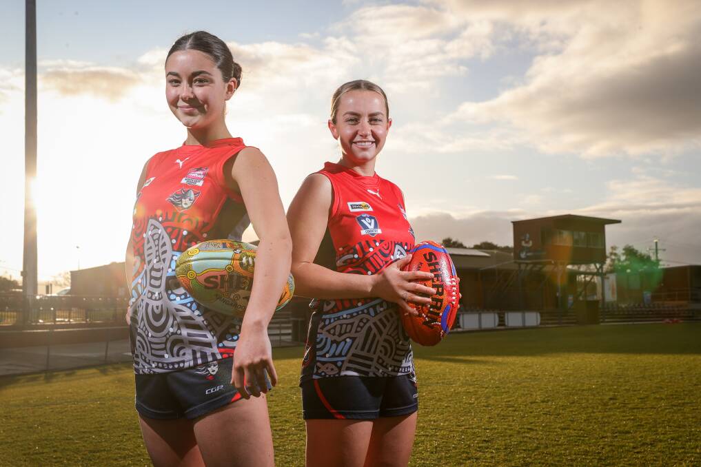 SPECIAL OCCASION: Wodonga Raiders' Ruby Crowe, 16 and Skye Burgess in the specially designed jumpers players will wear for the Female Football League's inaugural Indigenous match this weekend. Picture: JAMES WILTSHIRE