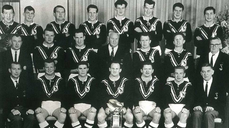 PREMIERSHIP SUCCESS: Arthur Summons (bottom with trophy) with his 1966 Wagga Magpies premiership teammates and officials.