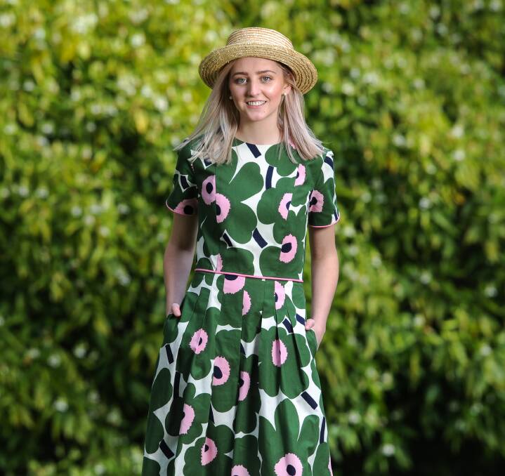 ONWARDS AND UPWARDS: Mollie O'Halloran models her winning floral jumpsuit in Albury's Botanical Gardens. It took out first place in the student category at Henty’s Natural Fibre Fashion Awards last week. Pictures: MARK JESSER 