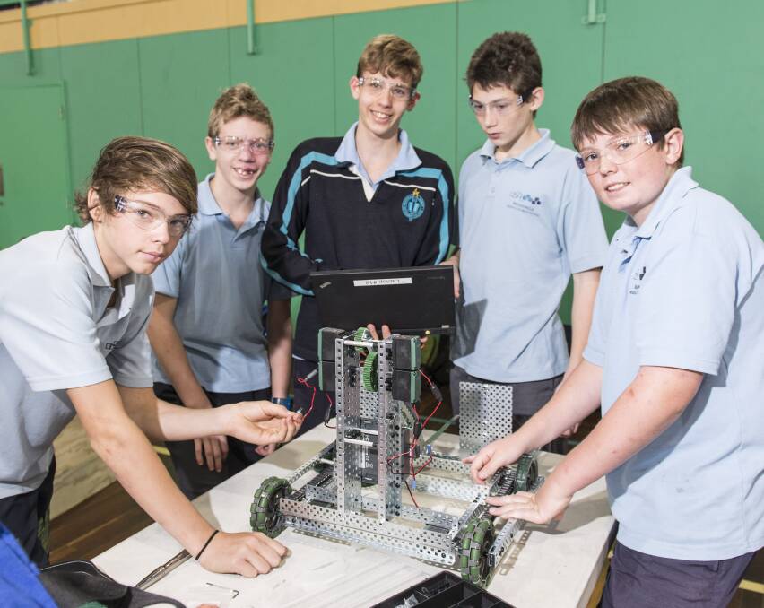 A-TEAM: Wodonga Middle Years College's Jake Bell, Alex Thomson, Mitchell Vogt, Sebastian Pullin and Jack Redcliffe add the final touches to their machine.