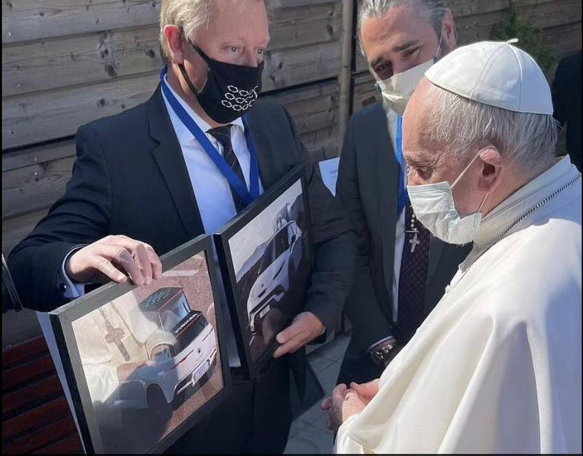 PAPAL TRANSPORT: Acclaimed car designer Henrik Fisker shows Pope Francis what his new all-electric Popemobile will look like. 