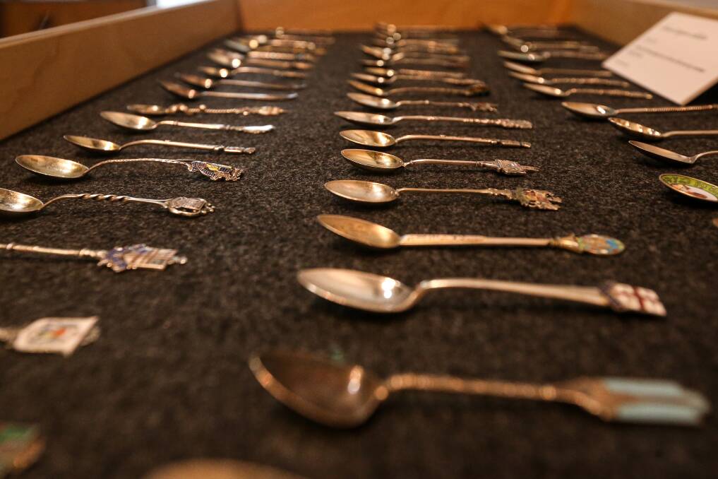 LOVE AND LOSS: A collection of more than 60 spoons (above) that James Simpson sent to his wife Grace from overseas is part of the Albury LibraryMuseum exhibition. Picture: JAMES WILTSHIRE