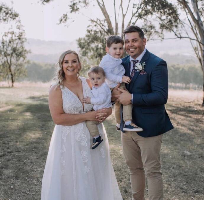 HAPPIEST OF DAYS: Grace and Matt Griffiths, with their sons James and Tommy, on their wedding day. Picture: SUPPLIED