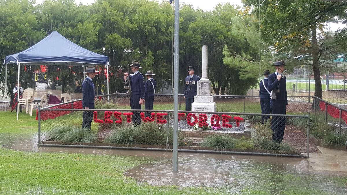 Young cadets stoic in rain.