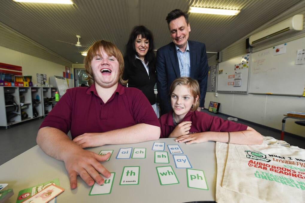 LITERACY SUPPORT: Tiffany James and Mike Jones (founders of UK-based online learning company Nessy) with Belvoir Special School students Wilbur Murray, 15, and Connor Stockfeld, 13. Picture: MARK JESSER