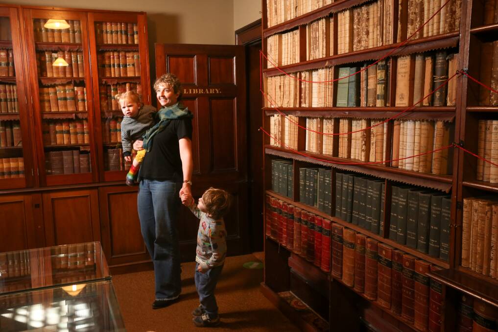 WATCH THIS SPACE: Lisa Peters and her children, Millie, 2, and Otis Collins, 3, inspect the library at historic Beechworth Courthouse, which will be transformed into a world-class heritage and museum space. Pictures: JAMES WILTSHIRE