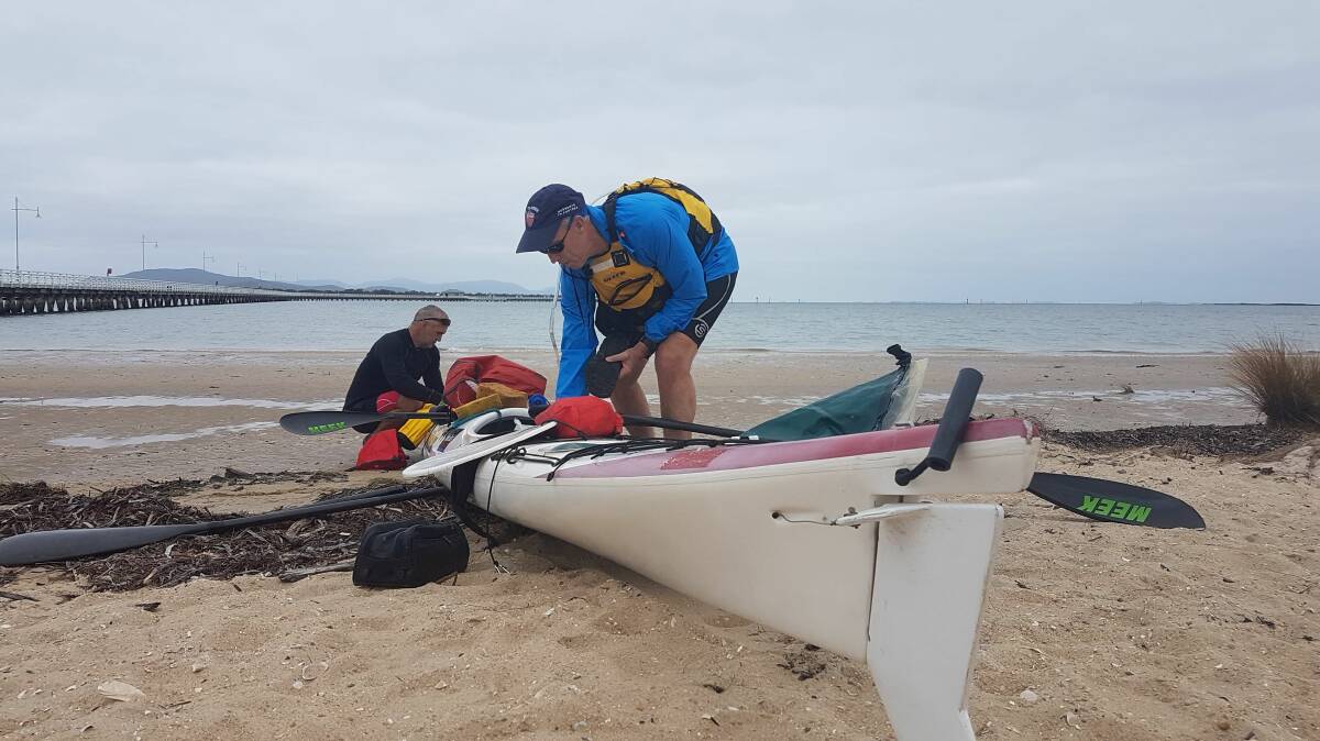 MAKING WAVES: Matt Flower and Stuart Baker on Monday morning ready to set sail on their Bass Strait paddle. PIcture: NOMAD FILMS