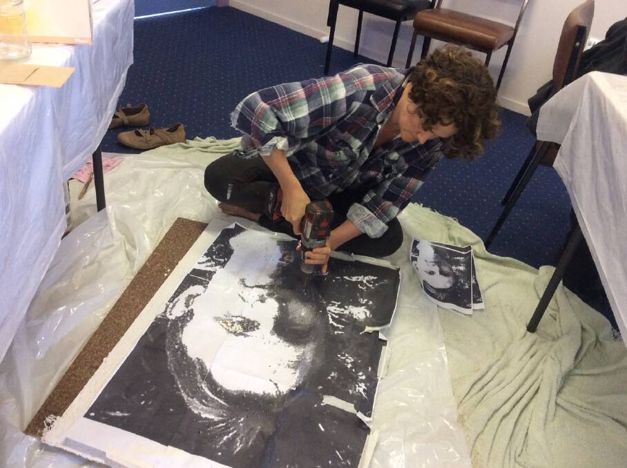 HANDS-ON HEALING: Melissa Lubke, working on a portrait of her late husband, will recreate her own art therapy on a bigger scale at Henty with the Rays of Light mural drilling workshop on Saturday.