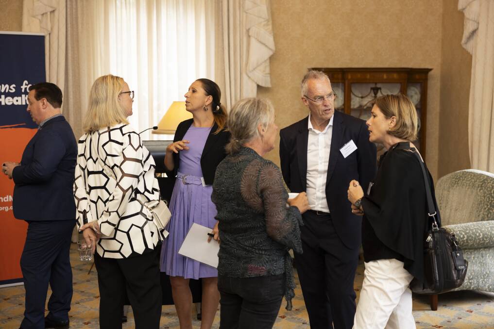 Albury's Stuart and Annette Baker speak with mental health advocates during the reception at Admiralty House, Kirribilli earlier this month. PIcture supplied