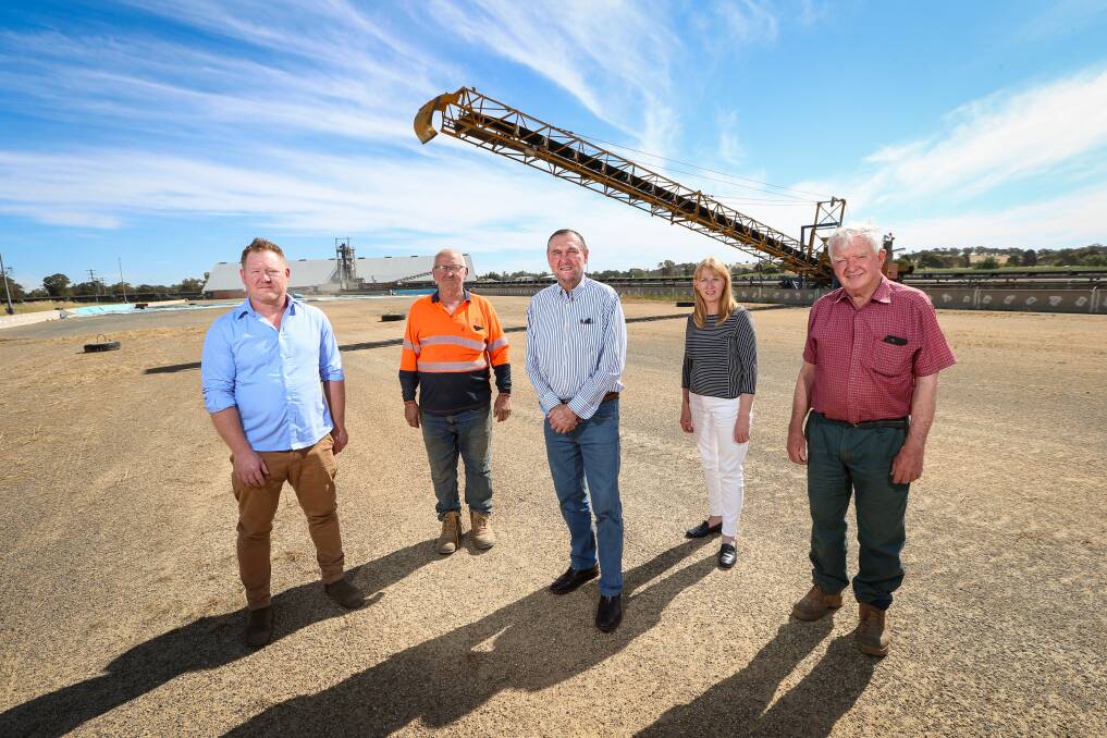 HEALTH SERVICE SUPPORT: Henty Respite Trust chairman Ben Hooper with GrainCorp site manager Rob Feltrin, and trust board members Mick Broughan, Mary Liston and Peter Campbell. Picture: JAMES WILTSHIRE
