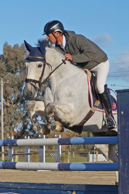 SILVER STEED: James Harvey in the mini prix at the Border Districts Showjumping Club's August 18 and 19 event at the Albury Wodonga Equestrian Centre. Pictures: JESS BERTRAM SUPPLIED