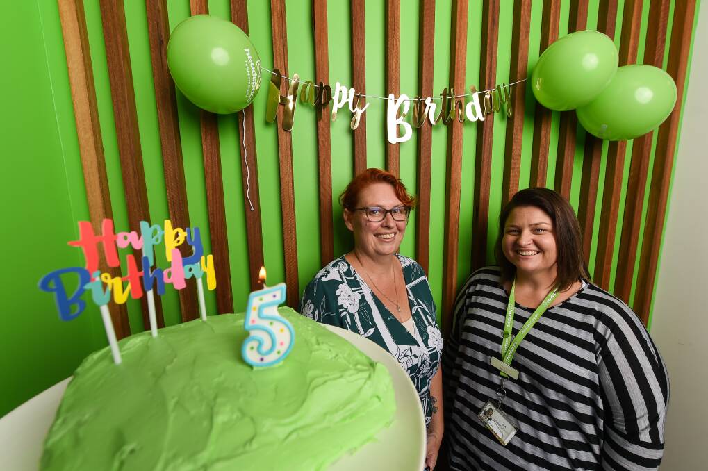 BIRTHDAY WISHES: Karina Kerr and Bree Cross prepare for Albury-Wodonga headspace's 5th birthday celebrations on Friday. Picture: MARK JESSER