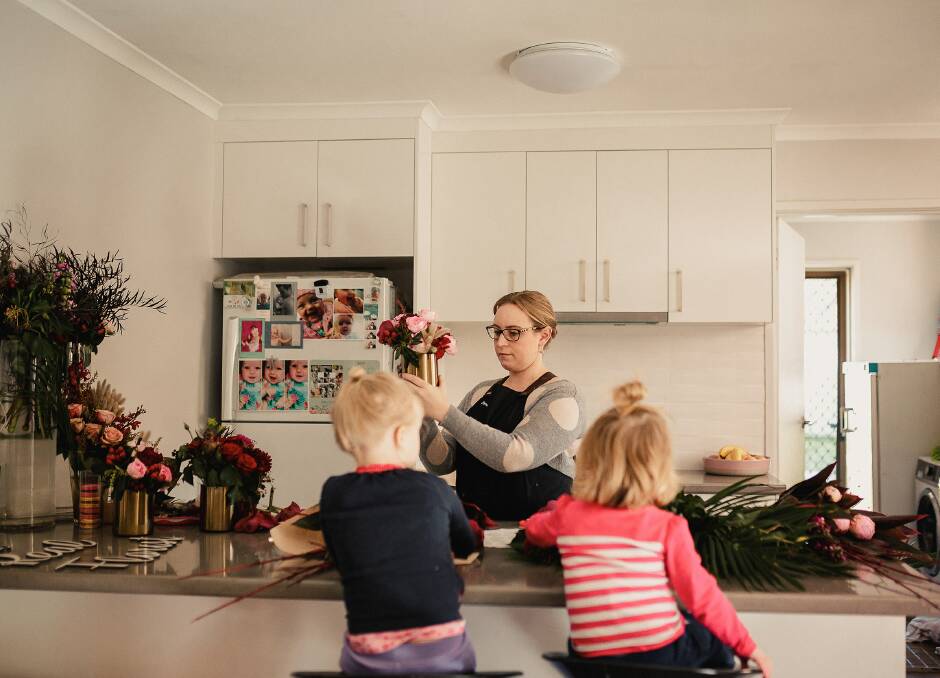 THE REAL DEAL: Florist Renee Williams, at home with daughters Marlie, 5,  and Amelia, 2, who will donate proceeds from a workshop to homelessness support service Restart Albury-Wodonga. Picture: CAPTURE BY KAREN