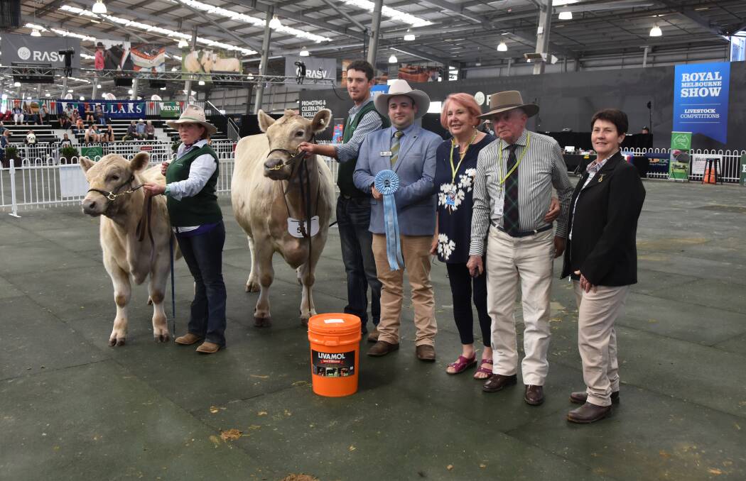 WORTH THE WAIT: Gina and Peter Sutherland (third from right) of Thologolong took out supreme murray grey exhibit at Melbourne Royal. Picture: FAIRFAX