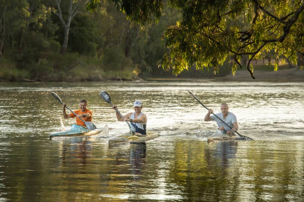 TAKING THE PLUNGE: Stuart Baker (right), with James Sloan and Russell Wood, prepares for the Bass Strait crossing with some practise on the Murray River. Picture: MARK JESSER