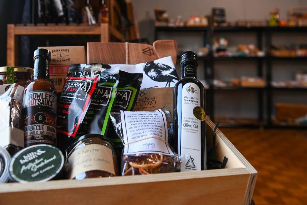 HAMPER HAPPINESS: A lack of options on regionally sourced hamper packages got Lisa 'fired up' to start her own business and has now opened The Riverina Hamper Co shop in the pub. Pictures: MARK JESSER