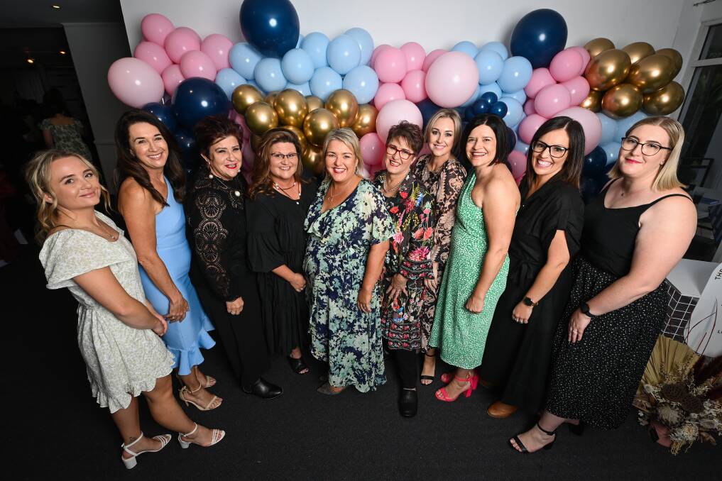 Women supporting women ... Managing director Andrea Lever (centre) with the team representing Ray White Albury North at Friday's fundraiser to support Betty's Place women's refuge. Picture by Mark Jesser