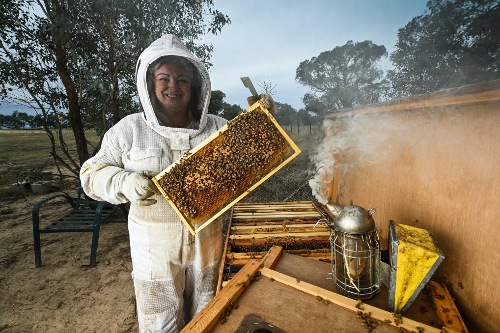 COME AND TRY IT: Table Top amateur beekeeper Sarah Schmidt is part of the new Albury Beekeeping Club. PIcture: MARK JESSER