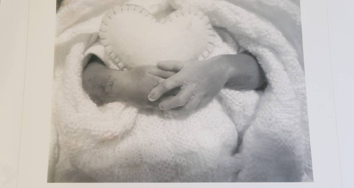 BORN SLEEPING: A special photograph of the tiny, precious fingers of Finn Butson has become a cherished keepsake for the family. Picture: HEARTFELT